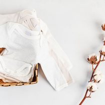 Cute newborn clothes. Organic cotton baby apparel mockup. Flat lay, top view