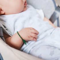 Close up of new born mixed race baby. Asian and British new born baby